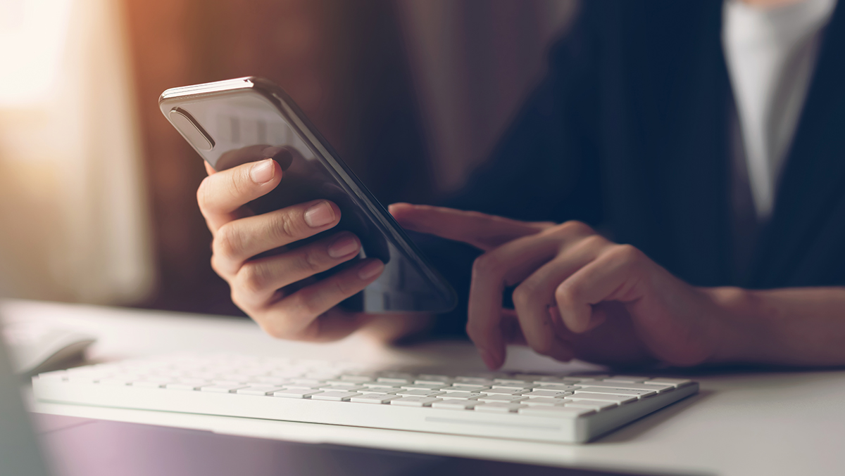 On phone at work desk