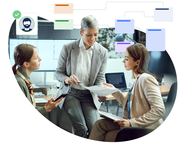 Women working on a project. Several overlapping windows show the process.